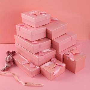 Pink gift box set with ribbons and bows for birthdays in various rectangular sizes
