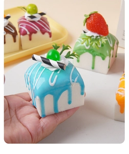 Macro shot of assorted colorful PU squishy cream cake models with realistic toppings