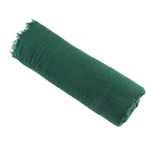 Deep green pleated cotton linen scarf with frayed edges shown in a rolled layout