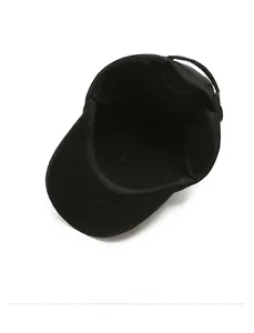 Detail view of the warm interior lining and stitching of the black winter outdoor cap