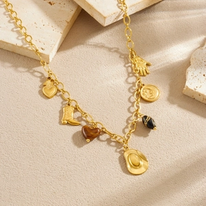 Gold-plated western cowboy necklace with heart, boot, hat, and moon charms on stone base