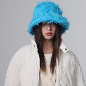 Detail of bright blue faux fur bucket hat showing soft plush texture and winter style