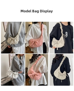 Detail view of pink and beige pleated crossbody bags with bow knots and ruched straps