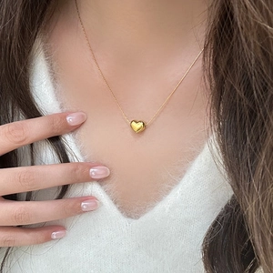 Elegant gold-plated puffy heart pendant necklace on a minimalist link chain for women