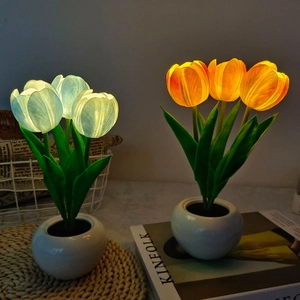 Close-up of artificial tulip night light showing soft petals in a white ceramic pot