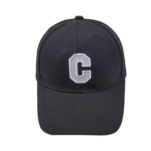 Close-up of the 3D white letter C embroidery on a black cotton canvas baseball cap