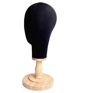 Professional linen covered mannequin head with a wooden base for wig and hat display