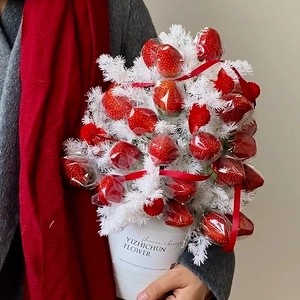 Creative strawberry flower bouquet gift box with red berries and white artificial foliage
