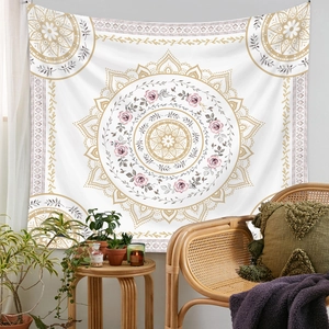 Bohemian mandala tapestry detail with pink roses and gold accents in a cozy room