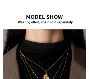 Close-up of a 18K gold-plated nautilus shell pendant necklace on a model