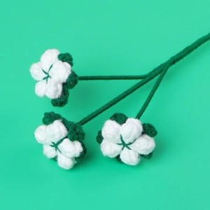Handmade crochet cotton flower bouquet featuring three white blooms on green stems
