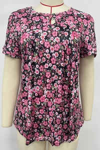 Detail of floral print t-shirt featuring pleated neckline and hollow-out design details