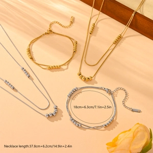 Elegant gold and silver snake chain necklace and bracelet set with adjustable links