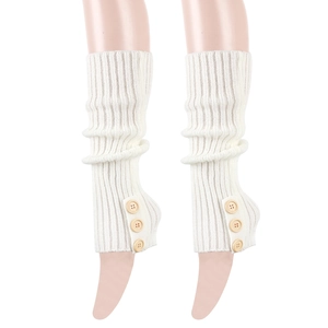 Detail view of white knit leg warmers with vertical stripes and wooden button accents