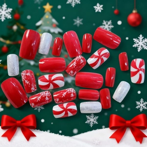 Classic Christmas press-on nails featuring red snowflakes and glitter stripes designs