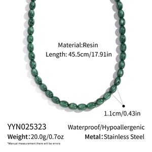 Detail view of green resin beaded necklace with stainless steel specs and measurements