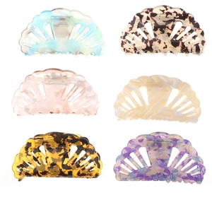 Set of six shell shaped hollow hair claws in various marble and floral patterns