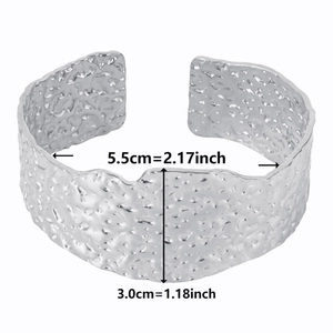 Detail of 3cm wide silver hammered titanium steel cuff bracelet with 5.5cm inner diameter