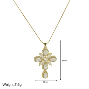 Detail view of 18k gold cross pendant with 43mm height and 29mm width specifications