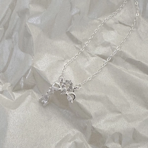 Macro view of 925 sterling silver ribbon necklace with sparkling zircon stones