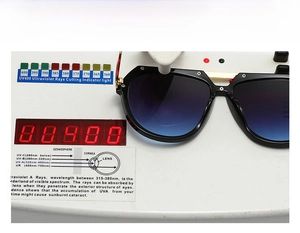 Detail of UV400 protection test for large frame men's sunglasses with blue gradient lenses