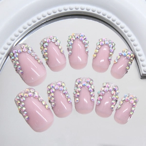 French glitter press-on nails in nude pink with AB rhinestones and silver sparkle