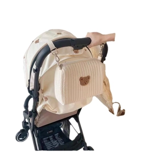 Quilted cotton baby stroller organizer bag featuring a cute brown bear embroidery