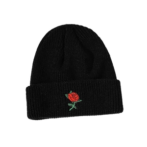 Classic black knit beanie with red rose embroidery and cuffed design for winter