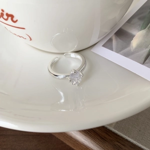 Detailed close-up of S925 sterling silver stamp on the adjustable zircon ring band