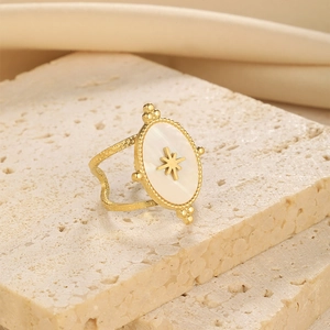 French vintage oval mother of pearl gold ring featuring a star pattern on a stone base