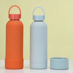Detail of insulated stainless steel bottles with silicone base and portable carry handles