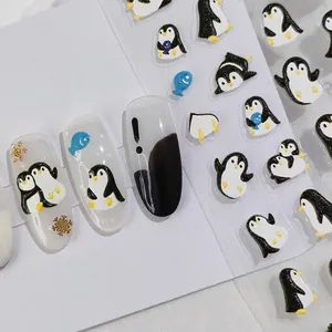 3D embossed penguin nail art stickers with blue fish and gold snowflake motifs
