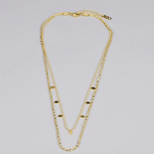 Detail of 18K gold-plated double-layer necklace with diamond charms and lobster clasp