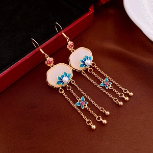 Detail view of Ruyi lock earrings with enamel flowers and gold tassel fringe