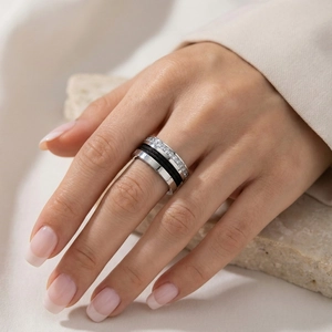 Detail of three-layer cable ring with micro-pave crystals and polished steel band