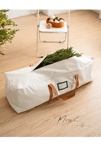 Detail of Christmas tree storage bag with transparent card slot and durable brown handles