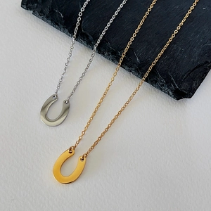 Minimalist U-shaped horseshoe pendant necklaces in gold and silver stainless steel