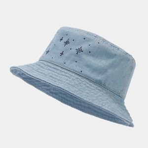 Detailed close-up of light blue denim bucket hat featuring sparkling star decorations