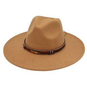 Detail of camel wool felt fedora with woven band, metal feather and ethnic beads