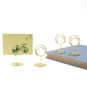 Golden round metal photo holder with spiral base for office desk and card display