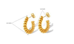 Detailed view of 23mm gold-plated titanium C-shaped twisted hoop earrings on white background