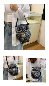 Detail of creative owl-shaped crossbody bag with gold zipper and textured feather pattern