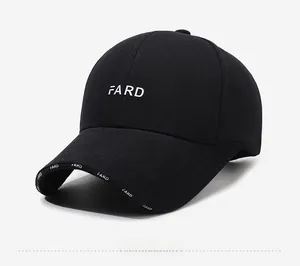 Detail of embroidered letters on black cotton twill baseball cap with printed brim