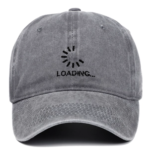 Detailed view of Loading embroidery and fabric texture on washed grey cotton baseball cap