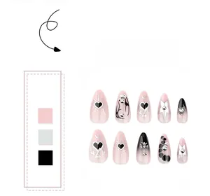 Detail of almond nails featuring black gradient, pink hearts, and 3D silver cross charms