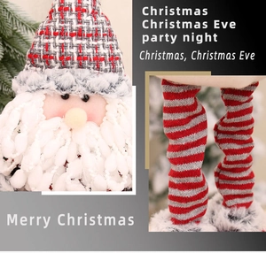 Detailed view of plush Santa doll with long striped legs and soft white beard decoration