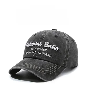 Close-up of National Basic embroidery on a black washed vintage cotton baseball cap