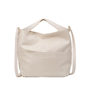 Minimalist creamy white faux leather tote bag with soft pleated texture and gold hardware