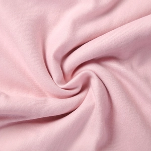 Solid pink cashmere-like winter scarf featuring soft knitted texture and elegant drape