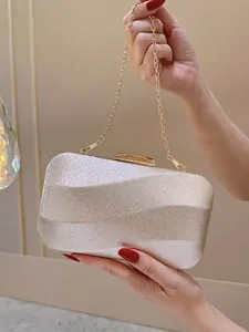 Champagne gold evening clutch with wavy texture and gold chain strap for parties